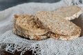 Many dietary airy crispbread on white burlap