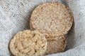 Many dietary airy crispbreads on white burlap