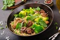 Dietary menu. Healthy vegan salad of vegetables - broccoli, mushrooms, spinach and quinoa