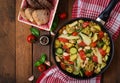 Dietary menu. Steamed vegetables with chicken fillet in pan on the wooden background. Royalty Free Stock Photo