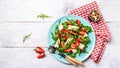 Dietary menu. Strawberry Salad with arugula, strawberries and cheese brie, camembert in a plate. Vegan food. Healthy food concept Royalty Free Stock Photo