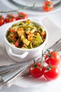 Dietary pasta with spinach, zucchini and cherry tomatoes