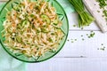 Dietary salad with cabbage, cucumber, carrot, greens. Juicy spring salad from fresh vegetables Royalty Free Stock Photo