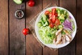 Dietary salad with chicken, avocado, cucumber, tomato and Chinese cabbage. Royalty Free Stock Photo