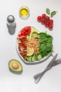 Dietary salad with chicken, avocado, cucumber, tomato and spinach. Hard light Royalty Free Stock Photo