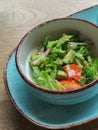 Dietary salad of fresh vegetables: cucumbers, radishes, tomatoes and broccoli, seasoned with olive oil. Royalty Free Stock Photo