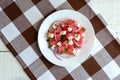 Dietary salad from fresh watermelon, blue onion and goat cheese (feta)