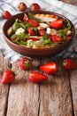 Dietary salad with strawberries, grilled chicken, brie and arugula close-up. vertical Royalty Free Stock Photo