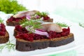 Dietary sandwiches with herring, boiled beets, red onion on rye bread Royalty Free Stock Photo