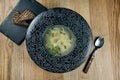 Dietary soup with chicken, vegetables and parsley in compostion with ingridients on wooden background in white bowl. Top view Royalty Free Stock Photo