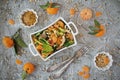 Dietary spinach salad and Mandarin oranges with dressing of mustard and pine nuts Royalty Free Stock Photo