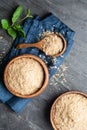 Dietary supplement, unfortified nutritional yeast flakes in a wooden bowl and scoop Royalty Free Stock Photo