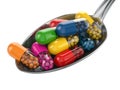 Dietary supplements. Variety pills. Vitamin capsules on the spoon. Royalty Free Stock Photo