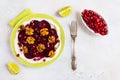 Dietary vegetarian salad of roasted beets with pomegranate seeds, walnuts caramelized in honey and natural yoghurt. Royalty Free Stock Photo