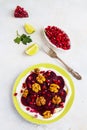 Dietary vegetarian salad of roasted beets with pomegranate seeds, walnuts caramelized in honey and natural yoghurt. Royalty Free Stock Photo