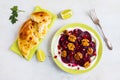 Dietary vegetarian salad of roasted beets with pomegranate seeds, walnuts caramelized in honey and natural yoghurt. Royalty Free Stock Photo