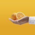 Dietician holding fresh tasty oranges