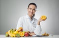 Dietician holding an orange Royalty Free Stock Photo