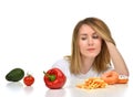 Dietician woman looking at vegetables avocado tomato pepper and