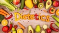 Dietics title text food lettering, made from pepper with different fruits and vegetables around, on wooden table Royalty Free Stock Photo