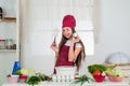 dieting. happy childhood. happy child wear cook uniform. chef girl in hat and apron. kid cooking food in kitchen Royalty Free Stock Photo