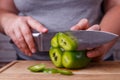 Dieting, healthy food, low carb diet. Hands slicing bell pepper,