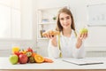 Dietitian nutritionist with bun and apple Royalty Free Stock Photo