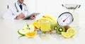 Dietitian nutritionist doctor prescribes prescription by consulting the digital tablet sitting at the desk office with fruits,