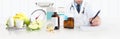 Dietitian nutritionist doctor prescribes prescription sitting at the desk office with apple, yogurt, medical drugs, tape meter and