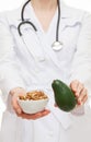 Dietitian proposing avocado and circassian walnut Royalty Free Stock Photo