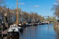 Dieze canal with boats het historical houses in the centre of the city Den Bosch. Royalty Free Stock Photo