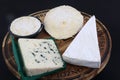 Diferent types of frenc cheese as brie, roquefort saint felicien and saint marcellin