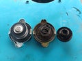 The difference between a diesel engine radiator cap that does not use coolant Royalty Free Stock Photo