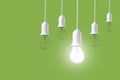 Difference light bulb on green background. concept of new ideas