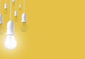 Difference light bulb on yellow background. concept of new ideas Royalty Free Stock Photo