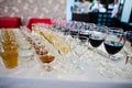 Different alcohol beverages in glasses on the table in restaurant or bar. Royalty Free Stock Photo