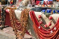 Different antiques on flea market or festival - vintage wooden, wool and natural coral necklace and other vintage things Royalty Free Stock Photo