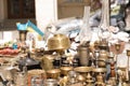 Different antiques on flea market or traditional festival - vintage lamps and other vintage things Royalty Free Stock Photo