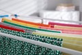 Different apparel drying on clothes airer indoors, closeup Royalty Free Stock Photo