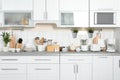 Different appliances, clean dishes and utensils Royalty Free Stock Photo