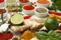 Different aromatic spices, lime and herbs on white background, closeup Royalty Free Stock Photo