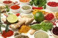 Different aromatic spices, lime and herbs on white background, closeup Royalty Free Stock Photo