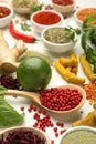 Different aromatic spices, lime and herbs on white background, closeup Royalty Free Stock Photo