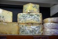 Different Asturian cheeses made from cow, goat and sheep melk on display in farmers cheese shop, Asturias, North Spain Royalty Free Stock Photo