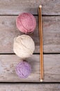 Different balls of yarn with wooden knitting needles. Royalty Free Stock Photo