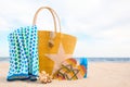 Different beach objects and coral on sand near sea Royalty Free Stock Photo