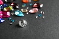 Different beautiful gemstones on black. Space for text Royalty Free Stock Photo