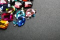 Different beautiful gemstones on background. Space for text Royalty Free Stock Photo