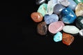 Different beautiful gemstones. Space for text Royalty Free Stock Photo