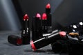 Different beautiful lipsticks on grey marble table, closeup